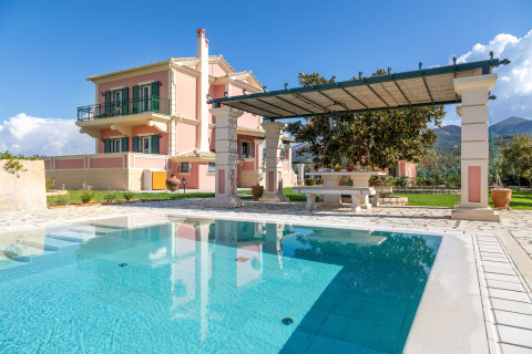 Pool terrace with sun loungers and umbrellas