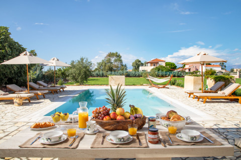 Shaded outdoor dining area under pergola