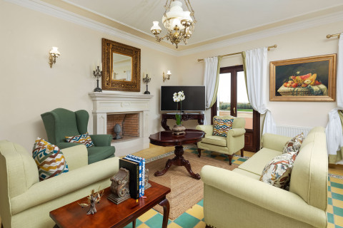 Bedroom with traditional artwork and comfortable bedding